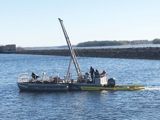 A barge floating on calm water.