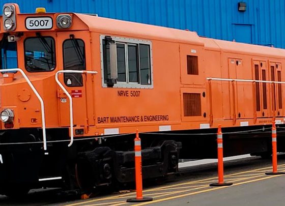 A 14-railcar maintenance train sits in a railyard.