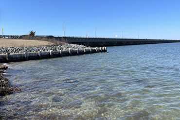 A bridge carries a highway over a body of water.