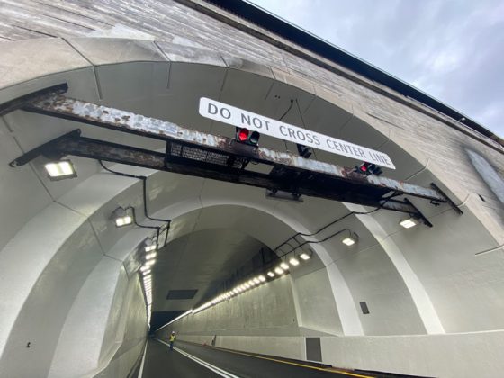 The entrance of one of the tunnel tubes showing the traffic signage.